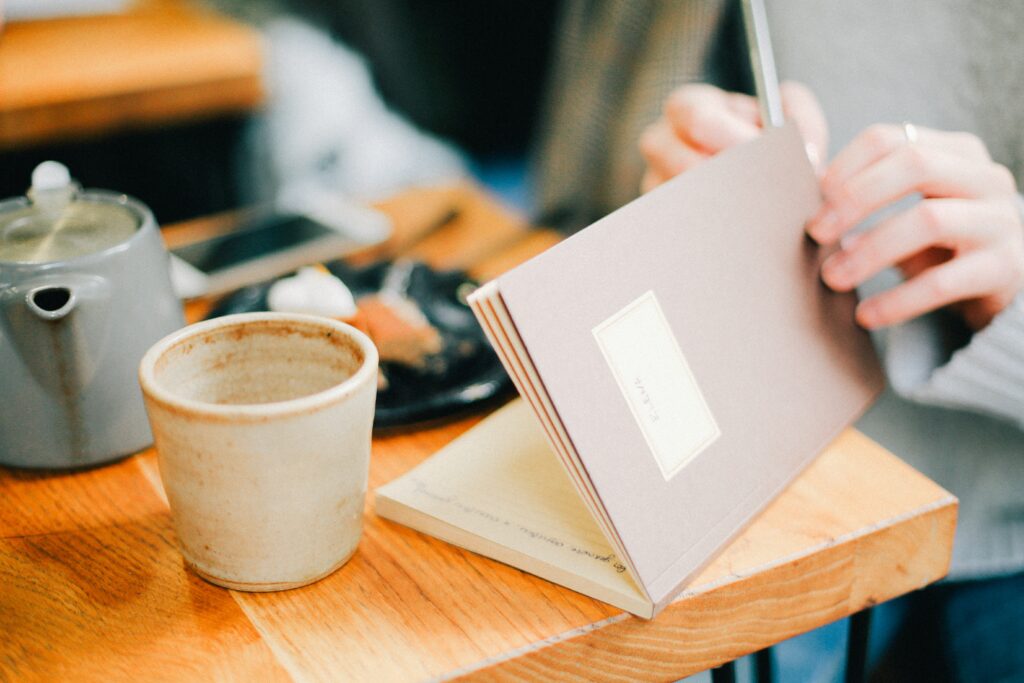 Notebook with coffee from Unplash